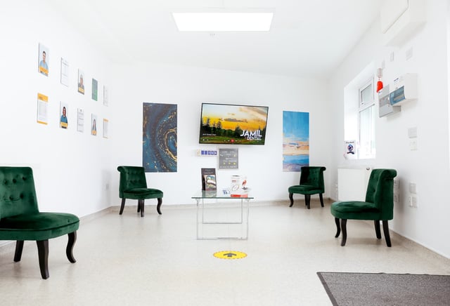 A dental surgery with treatment chair and monitor at Jamil Dental